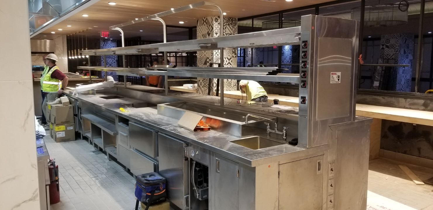 men working on a countertop 